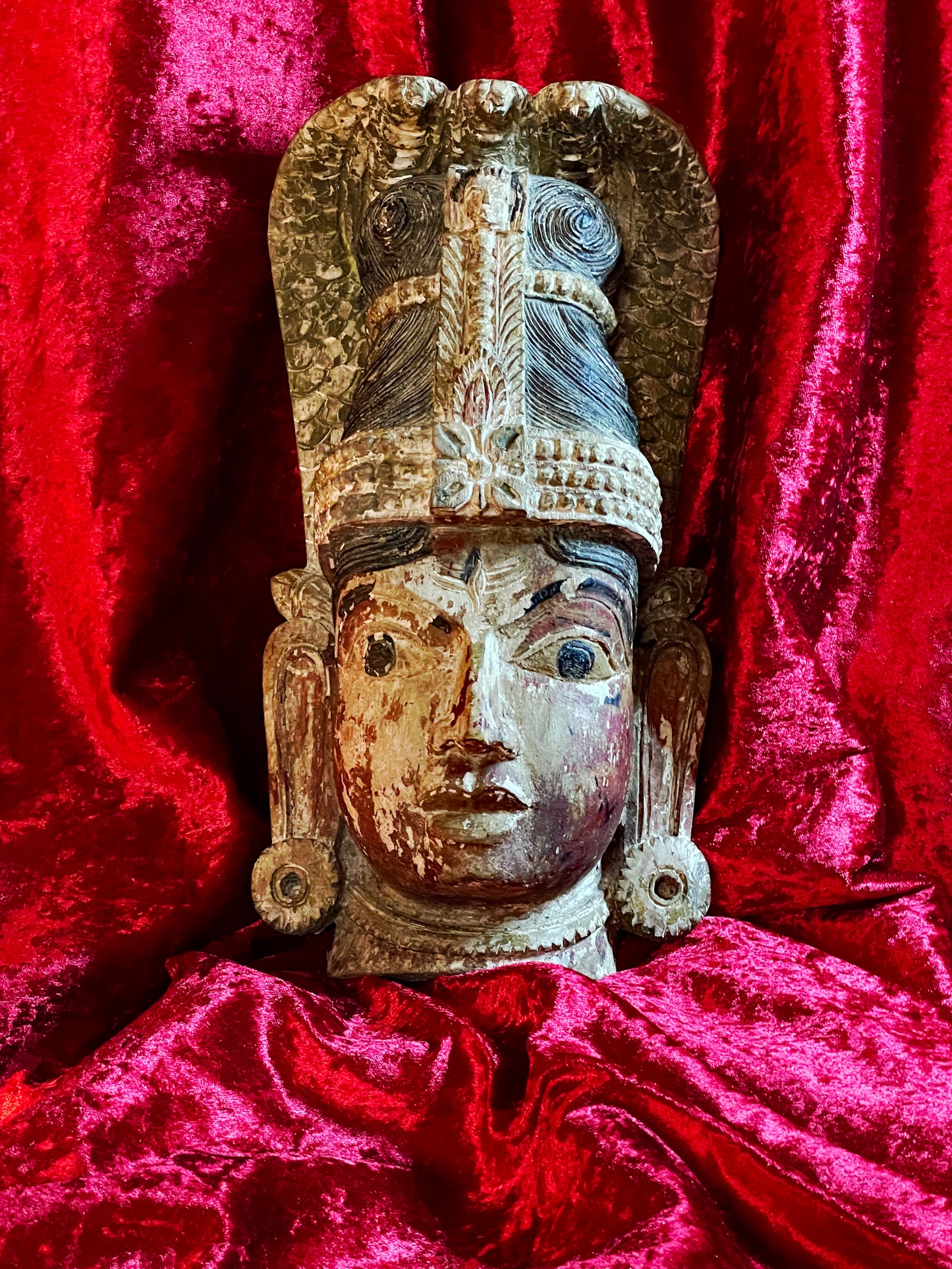 Naga temple mask three-quarter right view showing the cobra crown