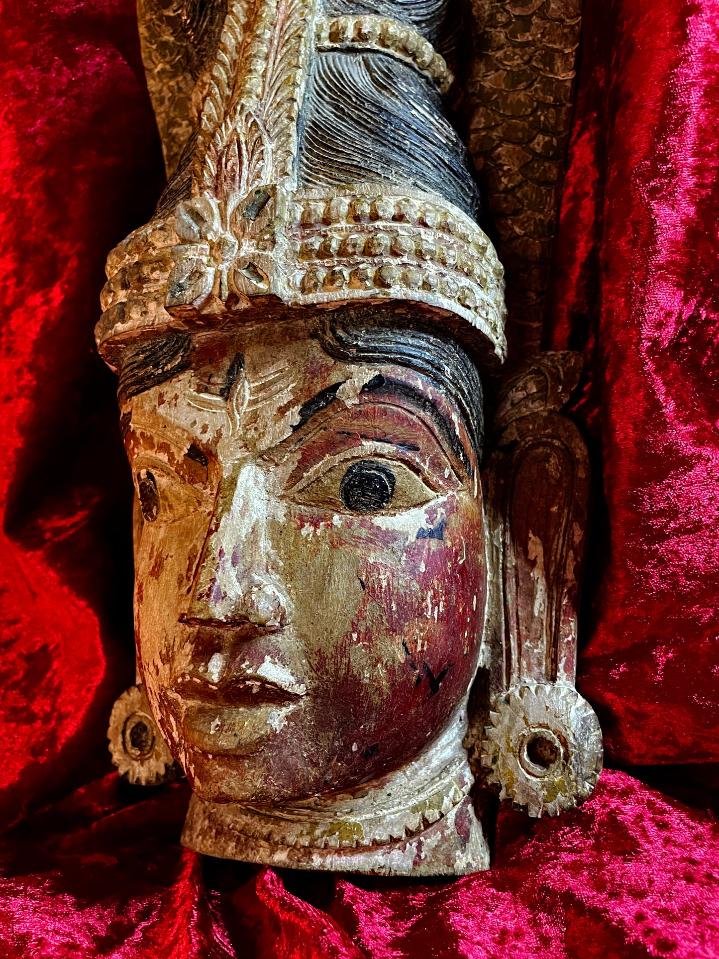 Three-quarter face detail with Makara-Kundala sun-ray ear ornament