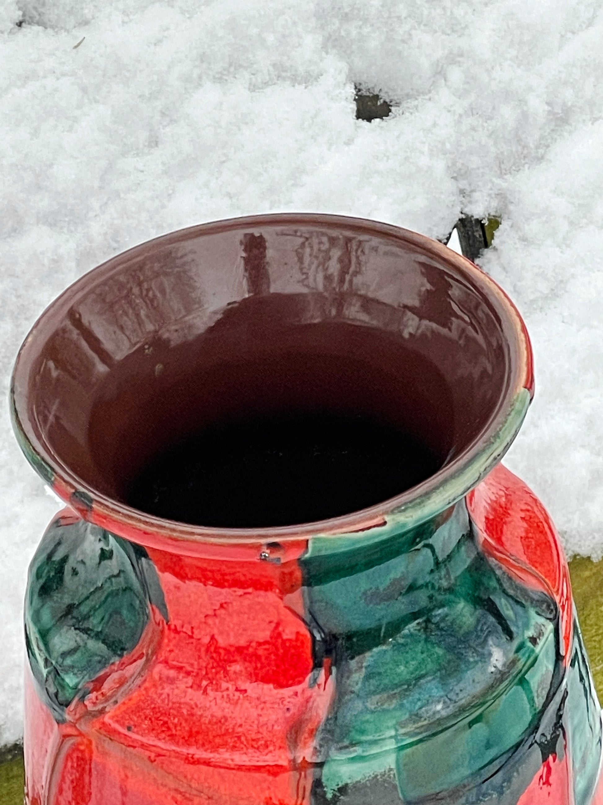 Close-up of the vase opening and glossy brown interior glaze