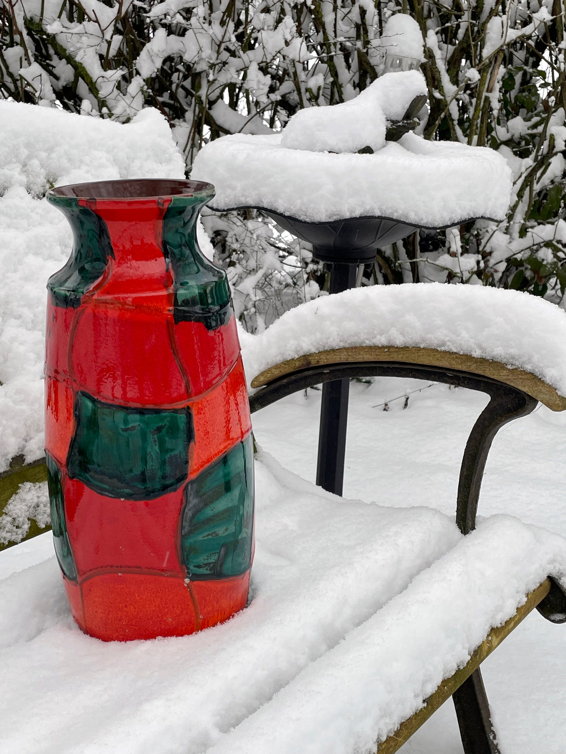 Side angle of the bold red and green glazed West German floor vase