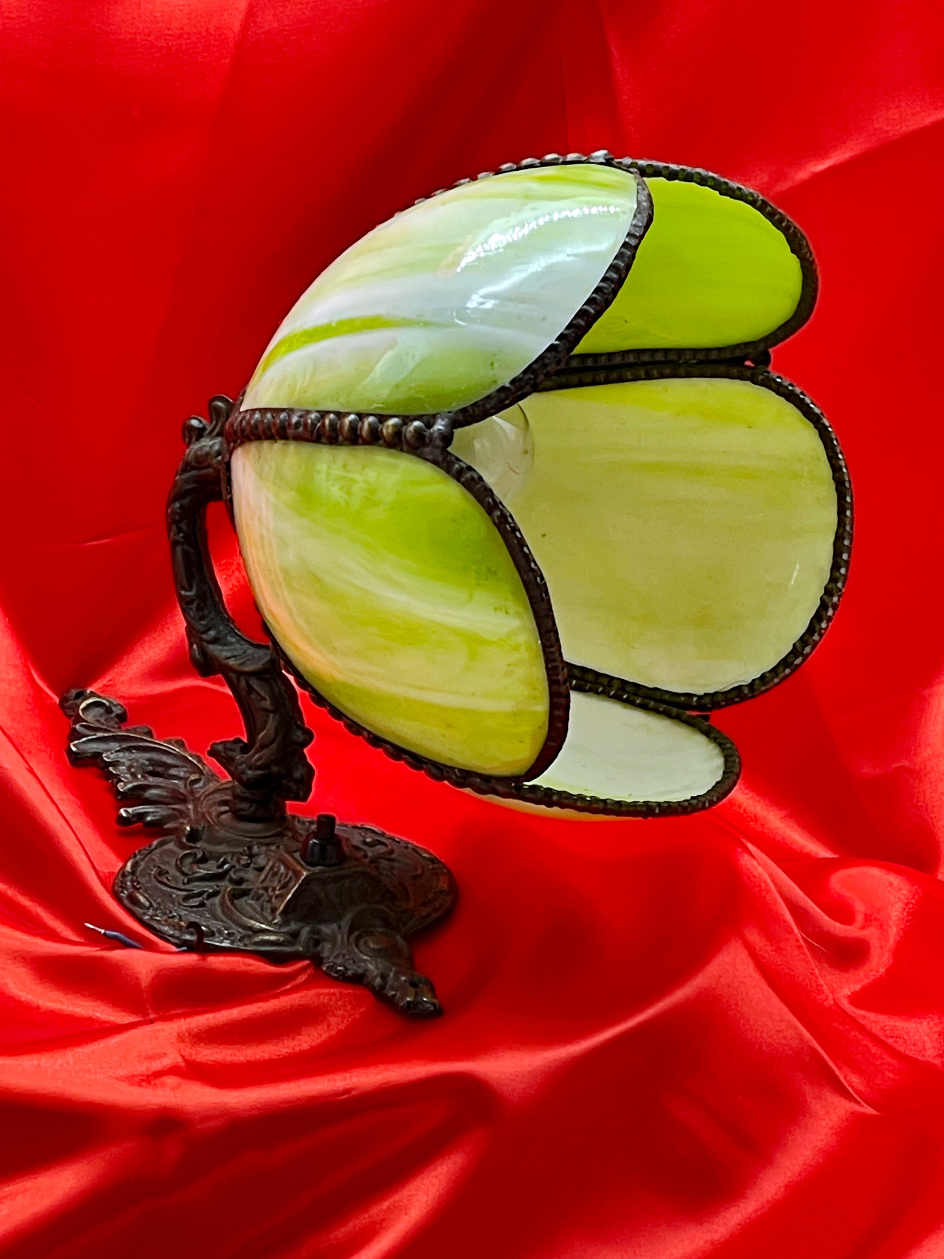 Full view of the bronze Art Nouveau wall sconce with open tulip glass shade and ornate cast base