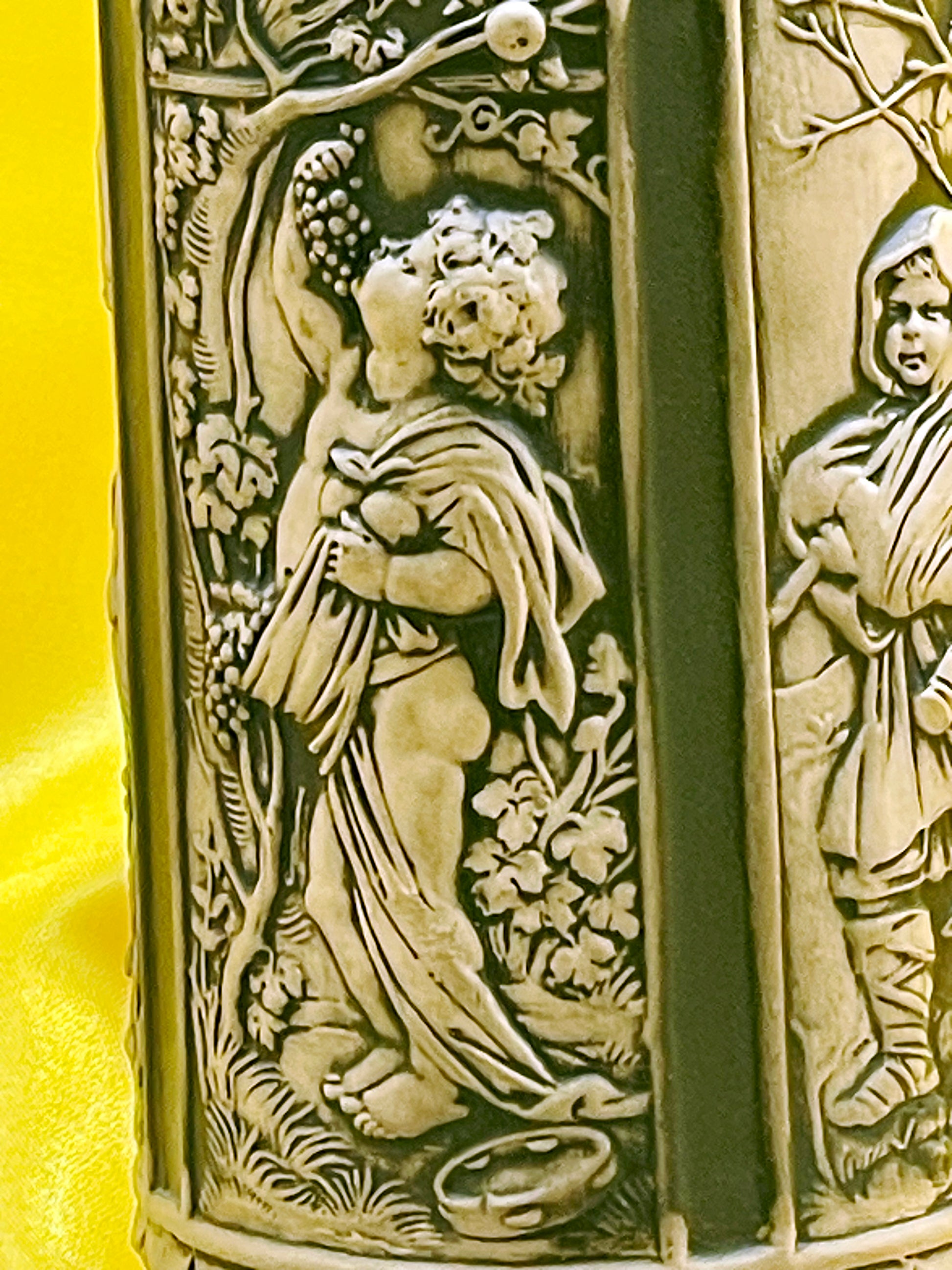 Detailed relief of classical maiden gathering grapes on German stoneware stein