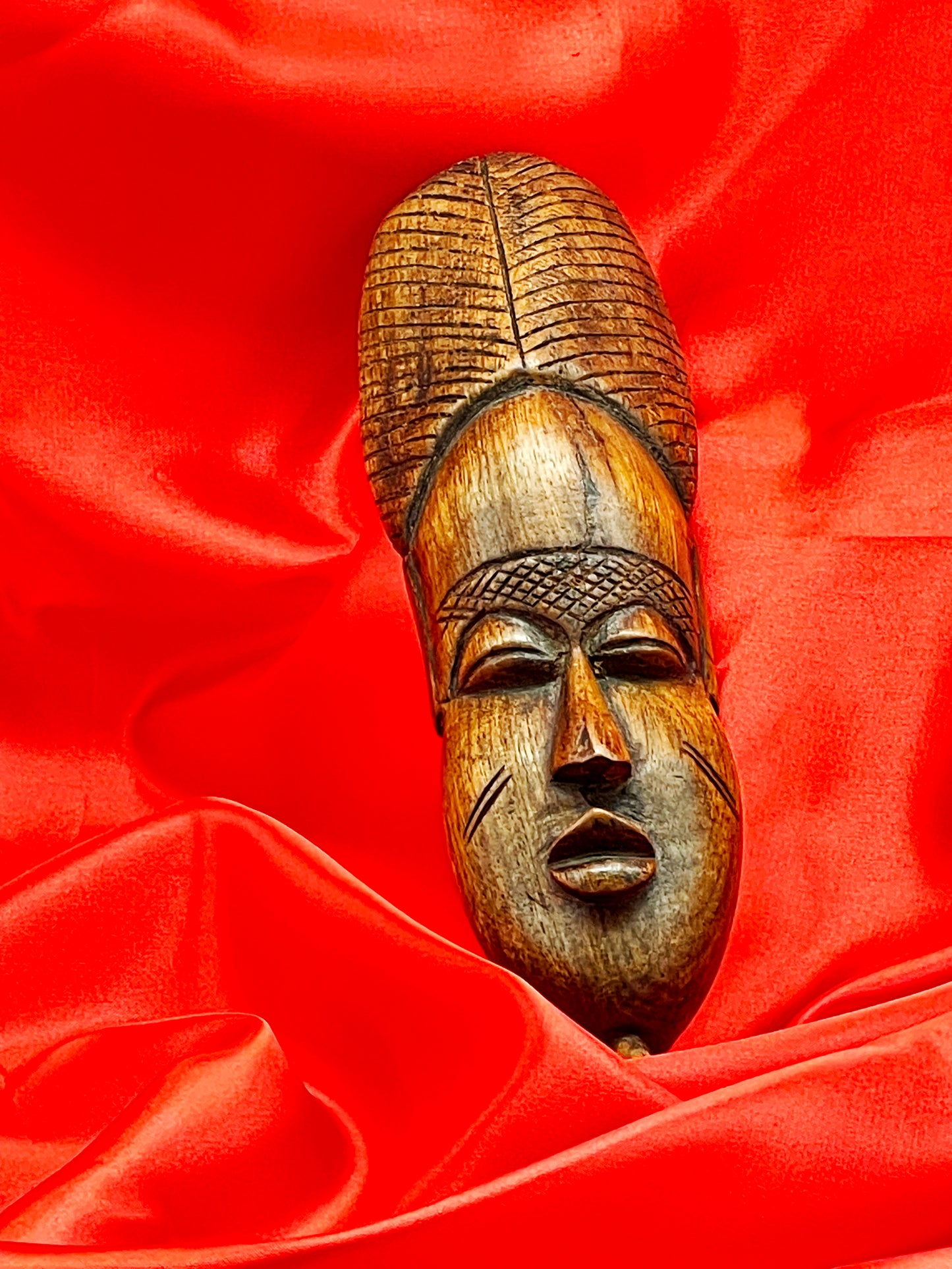 Dramatic upward angle of the elongated African hardwood mask