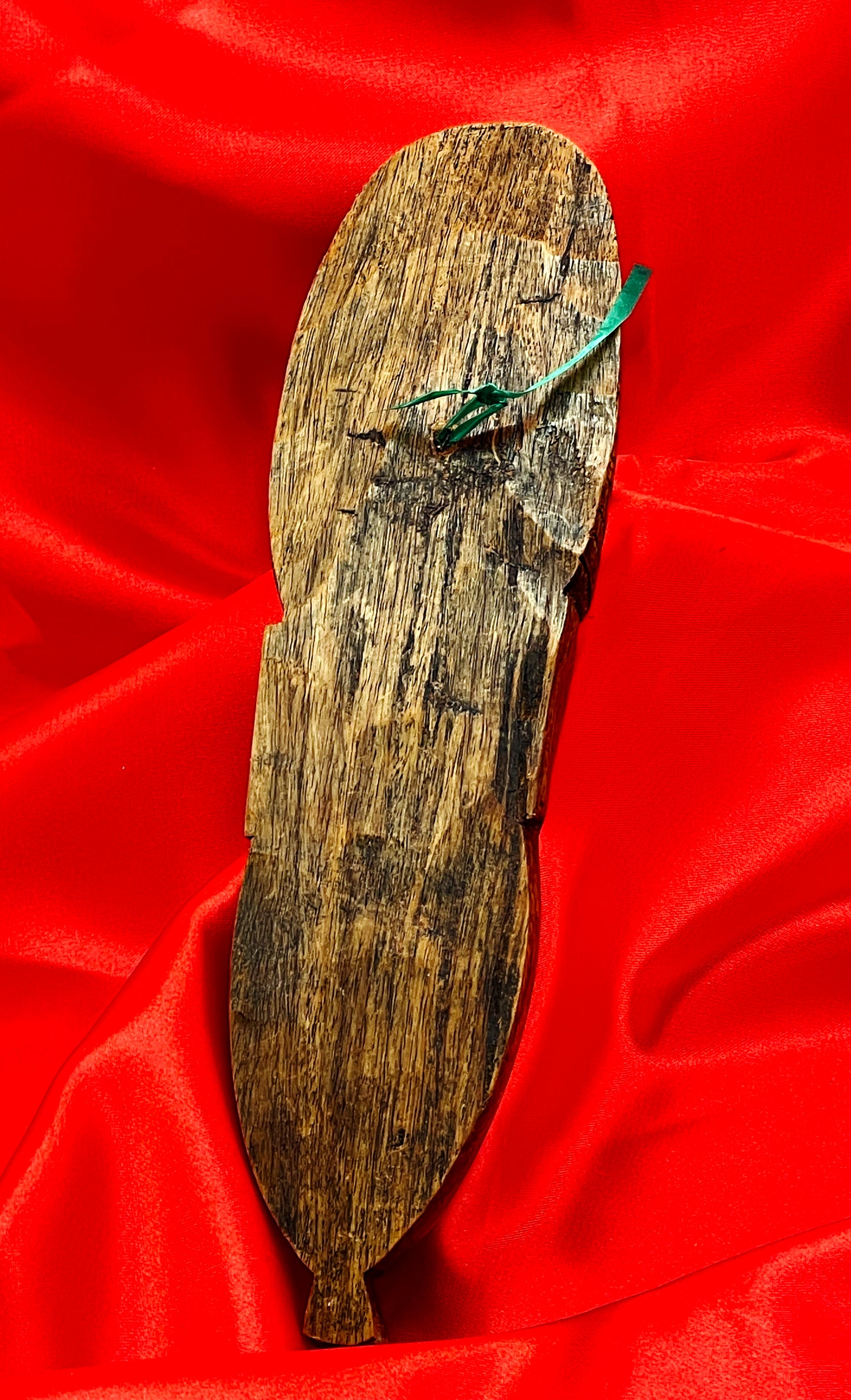 Reverse of the African hardwood mask showing the natural wood back and wall hanger
