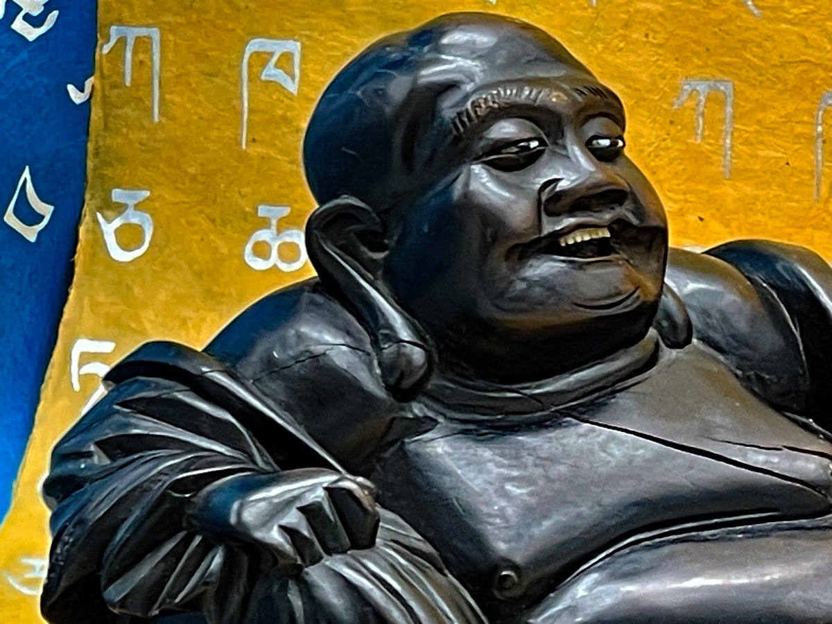 Carved ebony reclining Buddha, view of figure and original platform
