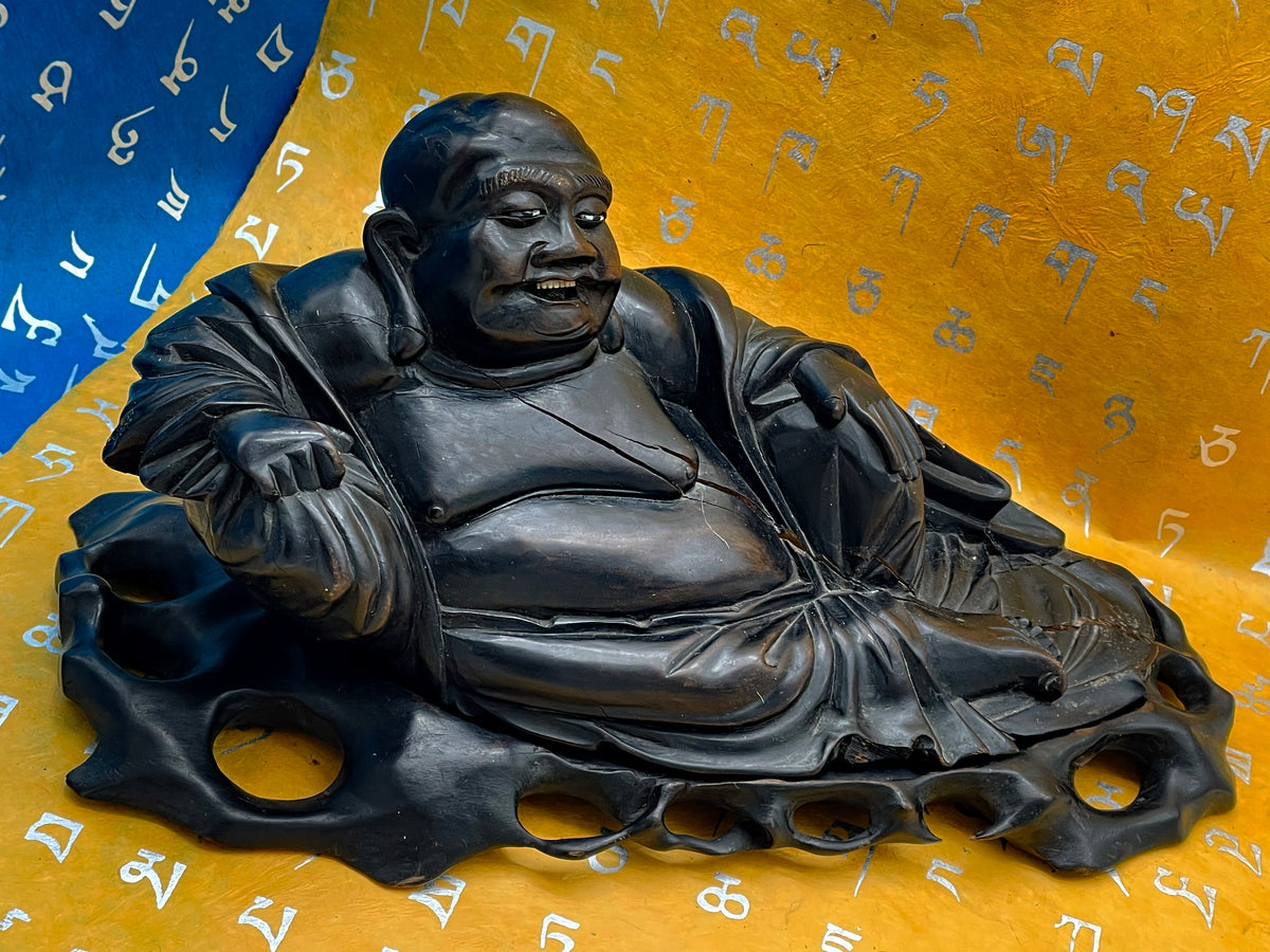 Antique ebony Buddha, alternate angle showing carving depth
