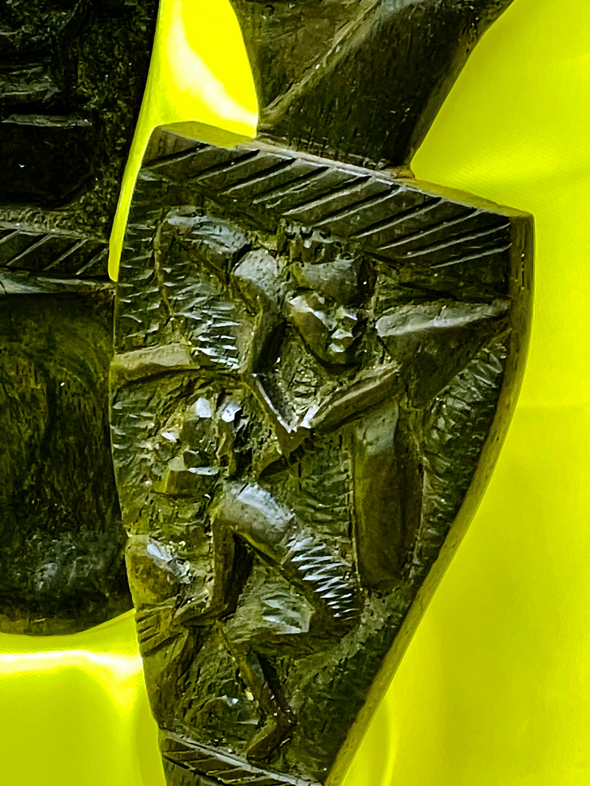Detail of the ebony carving showing patina and hand tooling