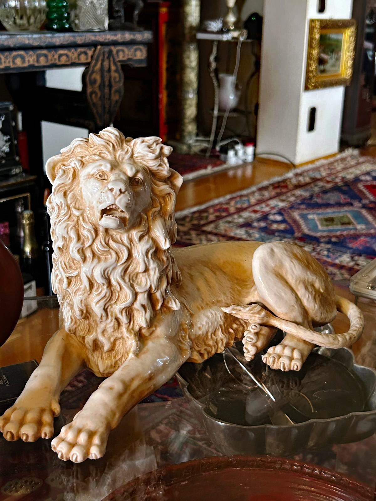 German Rudolstadt porcelain lion figurine, opposite profile showing flowing mane and tail
